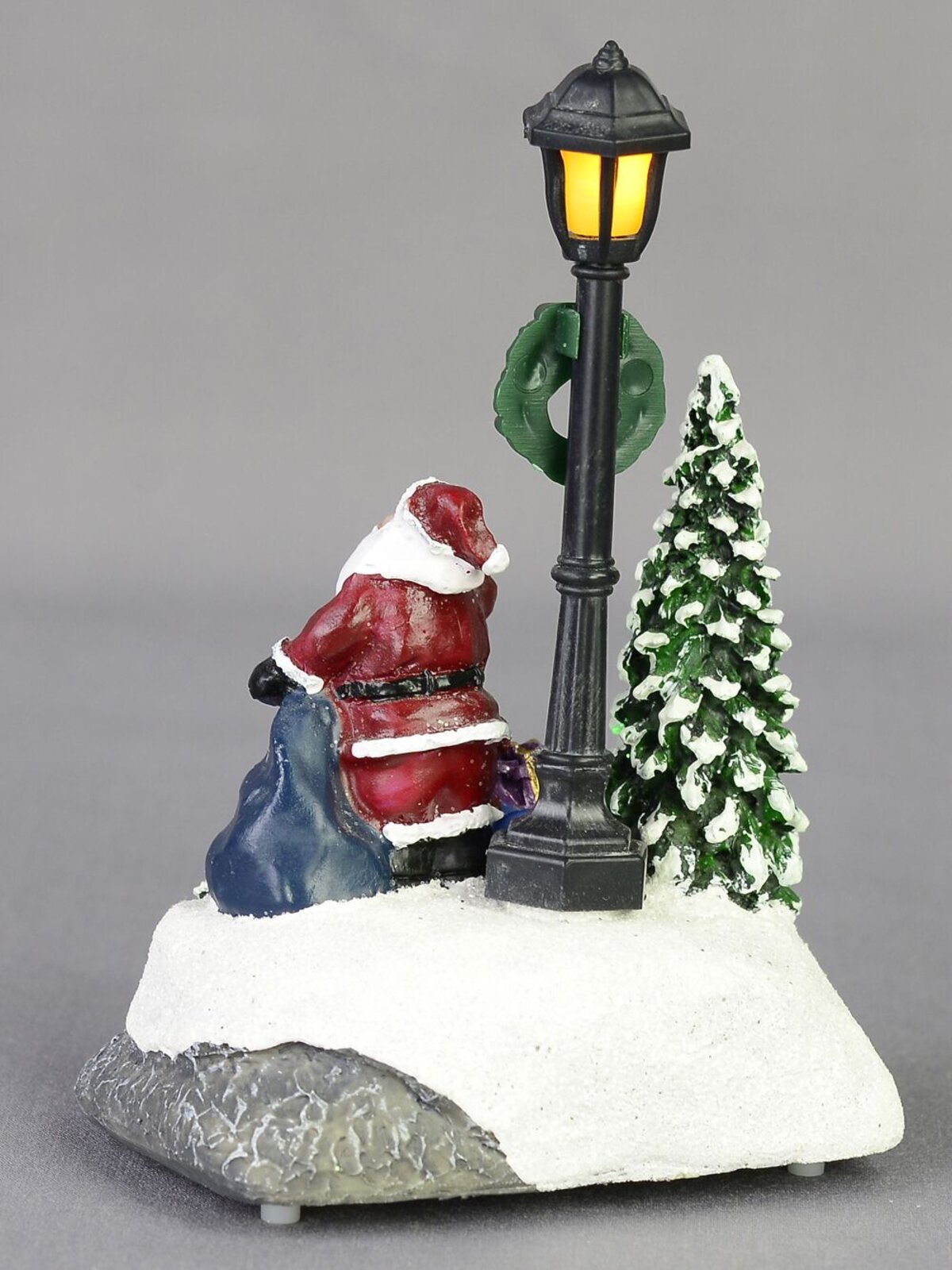 Illuminated Santa with Sack Under a Lamp Post Scene - 12cm